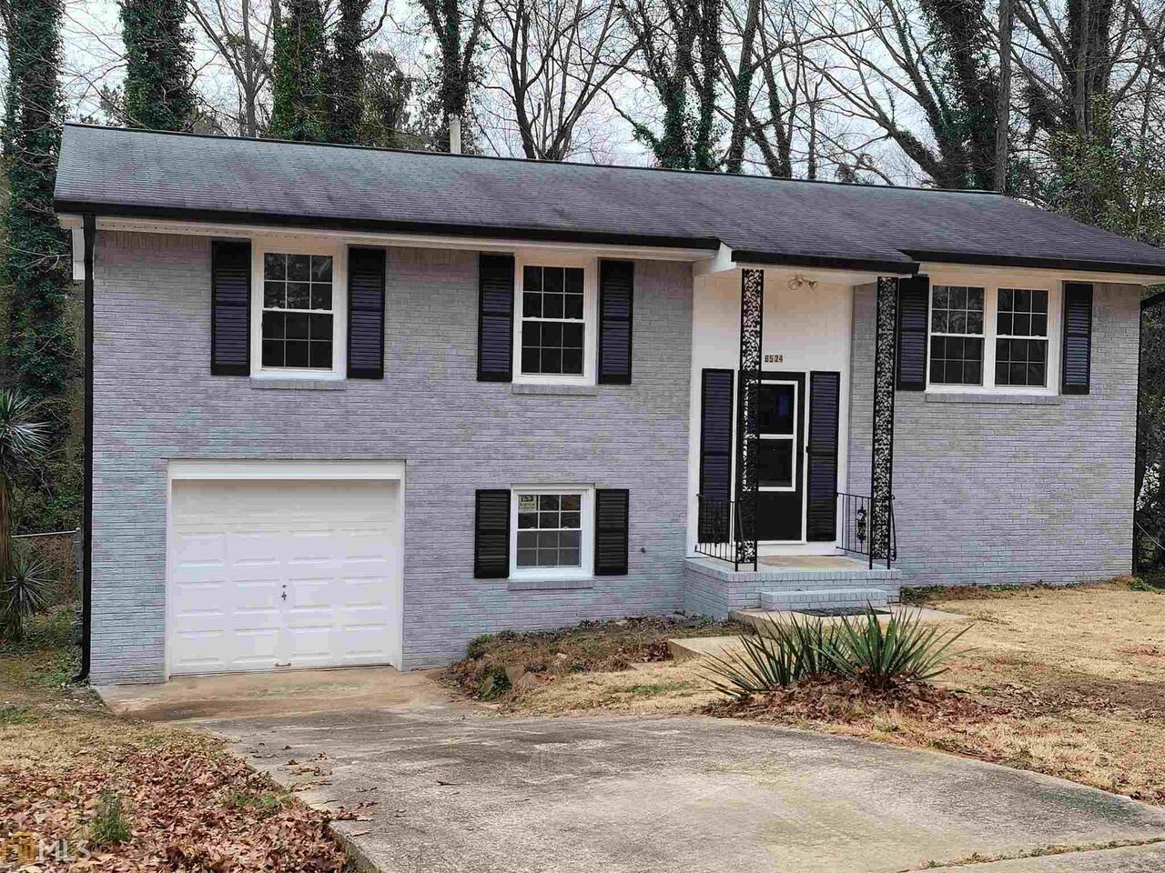 6524 Rabun Road Morrow, GA 30260 - Photo 1 of 1 a front view of a house with a yard and garage