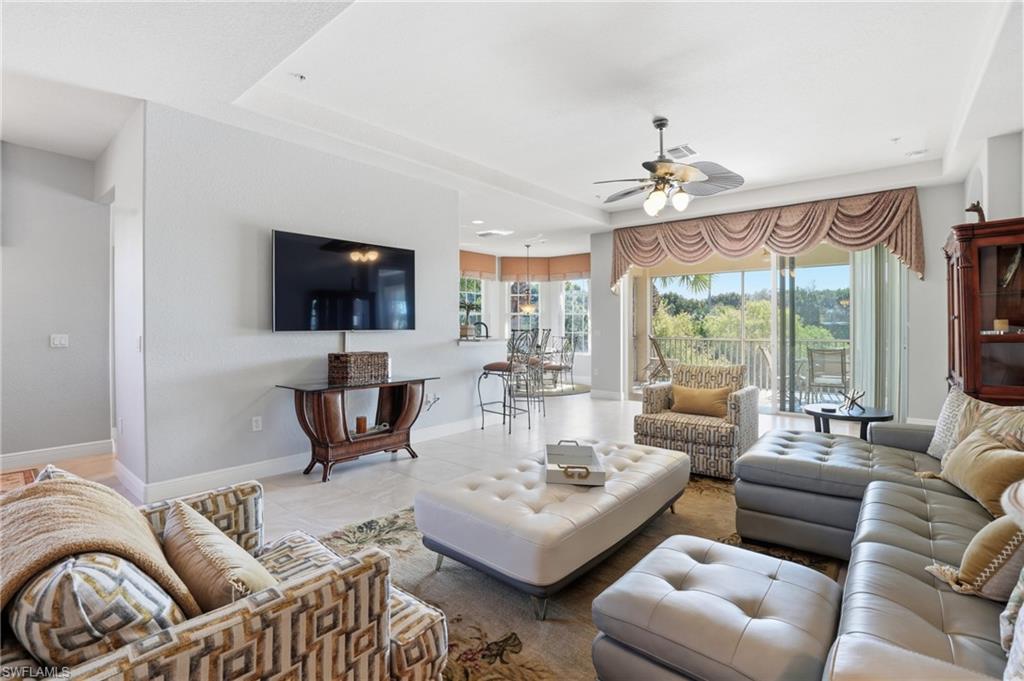 4620 Winged Foot Court, Unit 201 Naples, FL 34112 - Photo 12 of 44 Tiled living area with ceiling fan and recessed lighting
