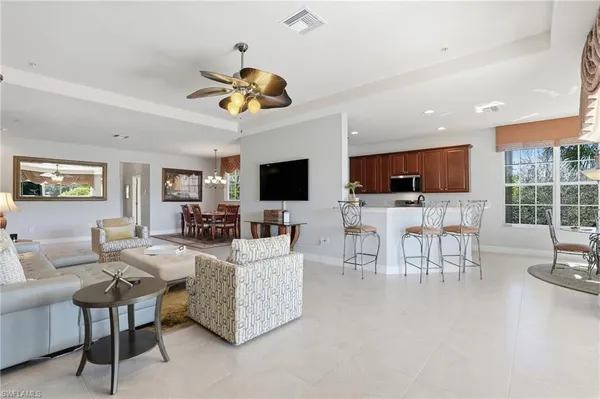 a living room with fireplace furniture and a flat screen tv