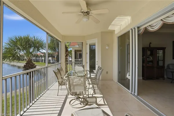 a view of a patio with table and chairs and potted plants