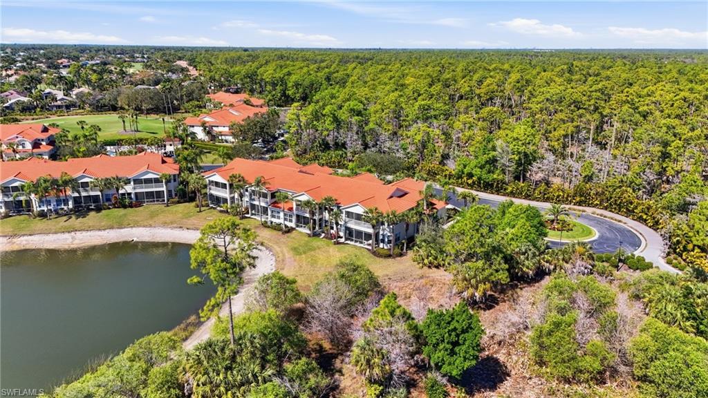 4620 Winged Foot Court, Unit 201 Naples, FL 34112 - Photo 37 of 44 Bird's eye view of a large body of water and a heavily wooded area