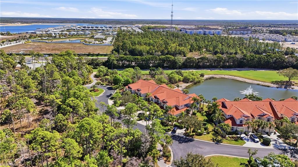 4620 Winged Foot Court, Unit 201 Naples, FL 34112 - Photo 6 of 44 Aerial view of residential area featuring a large body of water and a golf course