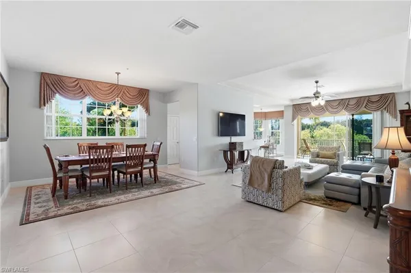 a view of a livingroom with furniture and a window