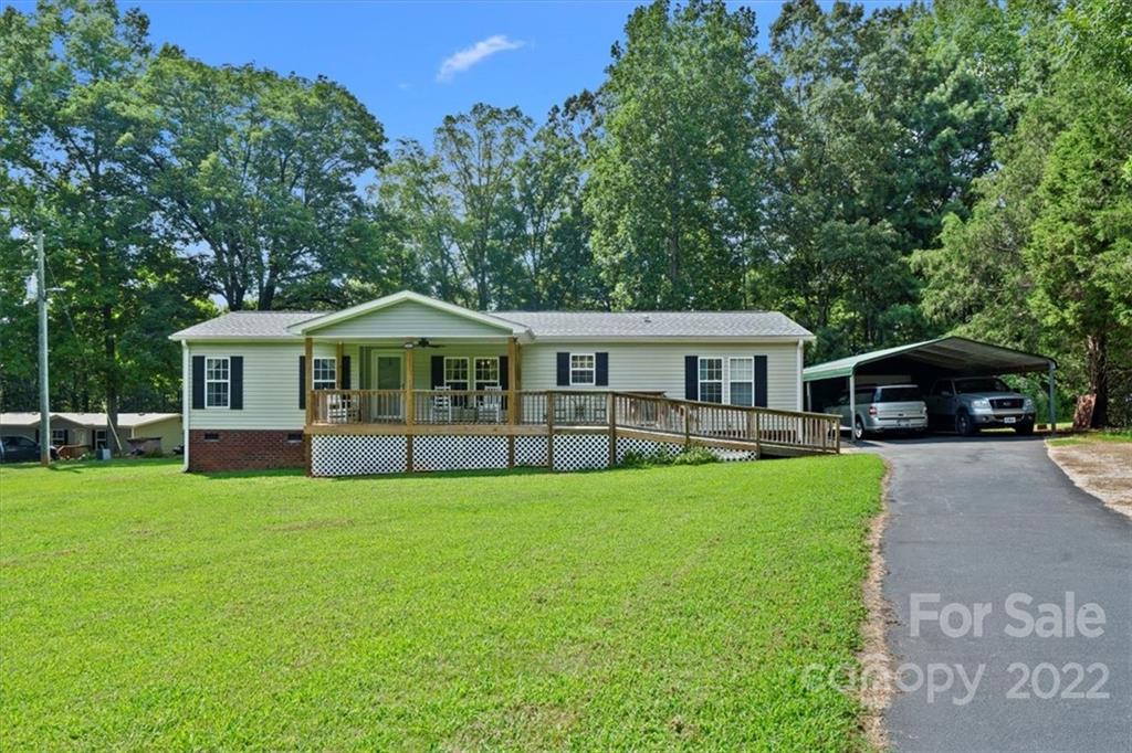 1158 Turkey Creek Ridge Road York, SC 29745 - Photo 1 of 13 a front view of a house with yard and green space