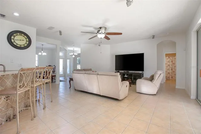 a large kitchen with a table and chairs