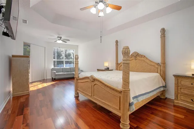 a bathroom with a granite countertop sink mirror bathtub and window
