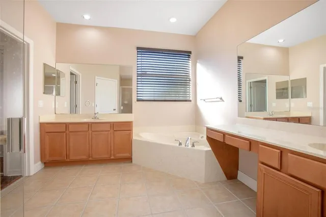 a view of a living hall with wooden floor and a cabinet
