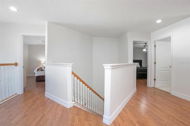 a room with a bed and a chandelier