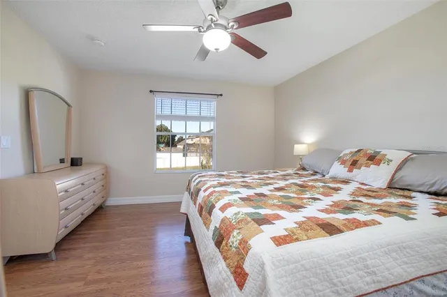 a bedroom with a bed and a desk