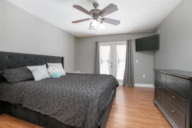a view of a house with backyard porch and sitting area