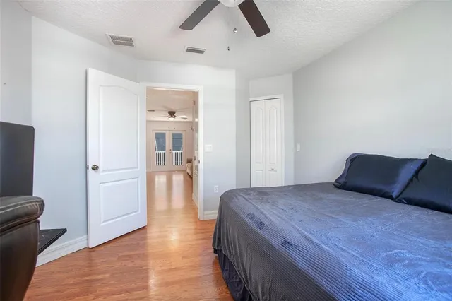 a view of a swimming pool with a porch and furniture