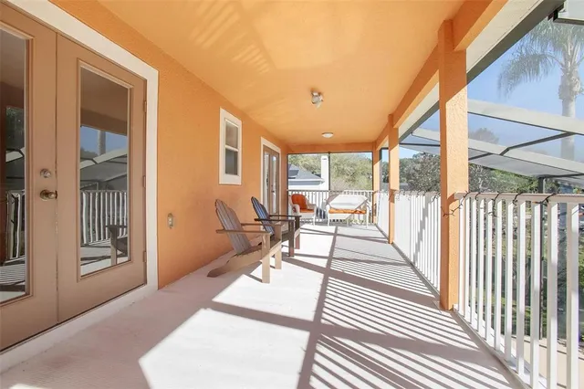 a view of a patio with table and chairs and potted plants