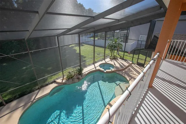 a large white kitchen with a large window