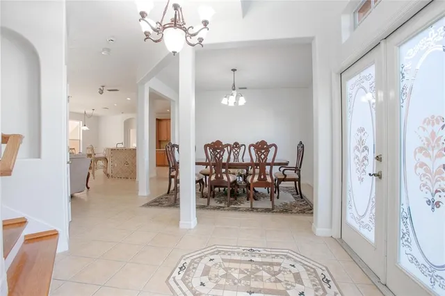 a view of a dining room with furniture window and chandelier