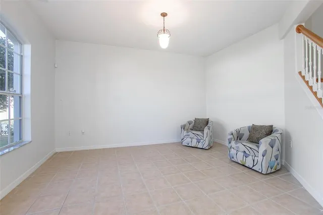 a view of a livingroom with furniture and stairs