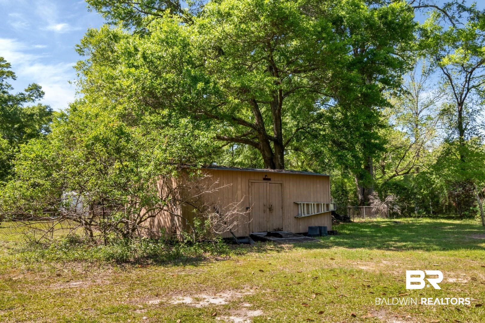 6300 Woodcrest Drive Mobile, AL 36608 - Photo 29 of 35 View of yard with fence and an outdoor structure
