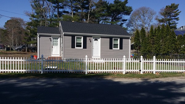 50 Cohasset Road Wareham, MA 02532 - Photo 1 of 11 a front view of a house with a garden