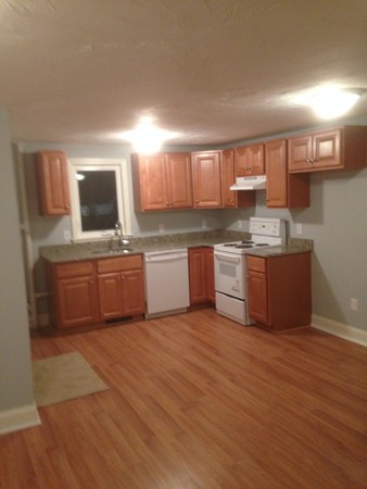 50 Cohasset Road Wareham, MA 02532 - Photo 3 of 11 a kitchen with stainless steel appliances a sink and a stove top oven