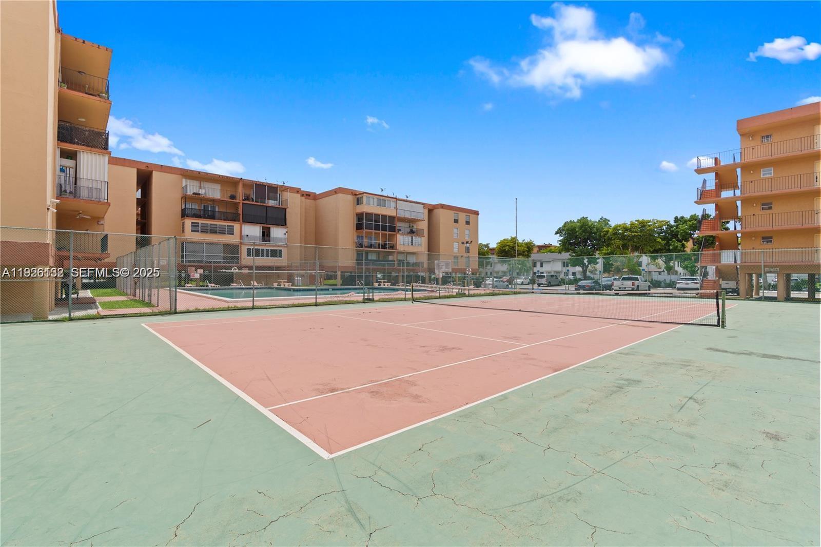 1810 West 56th Street, Unit 3223 Hialeah, FL 33012 - Photo 19 of 19 a view of a tennis court