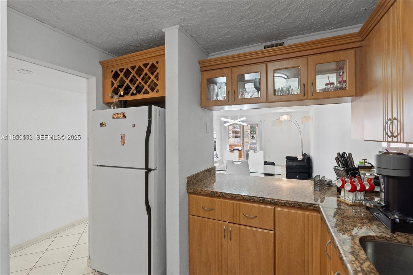 1810 West 56th Street, Unit 3223 Hialeah, FL 33012 - Photo 7 of 19 a kitchen with stainless steel appliances a refrigerator and a sink