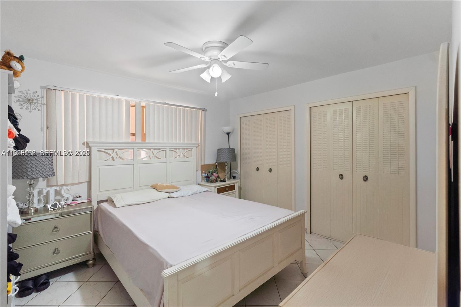 1810 West 56th Street, Unit 3223 Hialeah, FL 33012 - Photo 8 of 19 a bedroom with a bed and a window