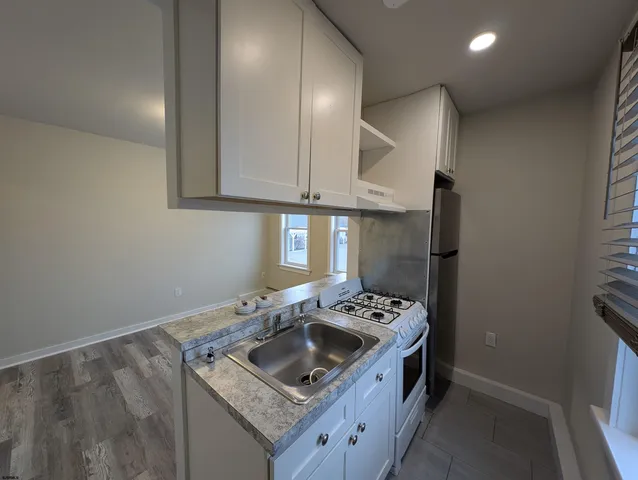 a room with a fireplace and wooden floor