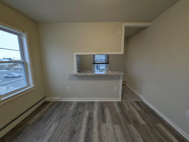 a bathroom with a bathtub and a toilet