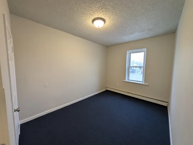 an empty room with wooden floor