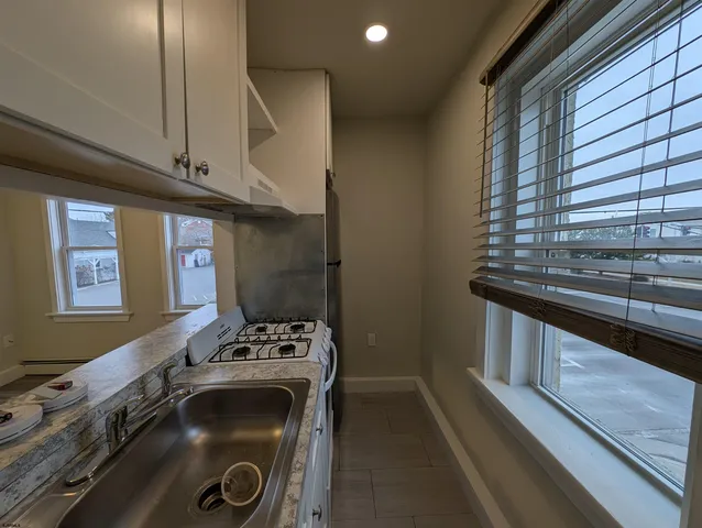 a kitchen with a stove and a sink