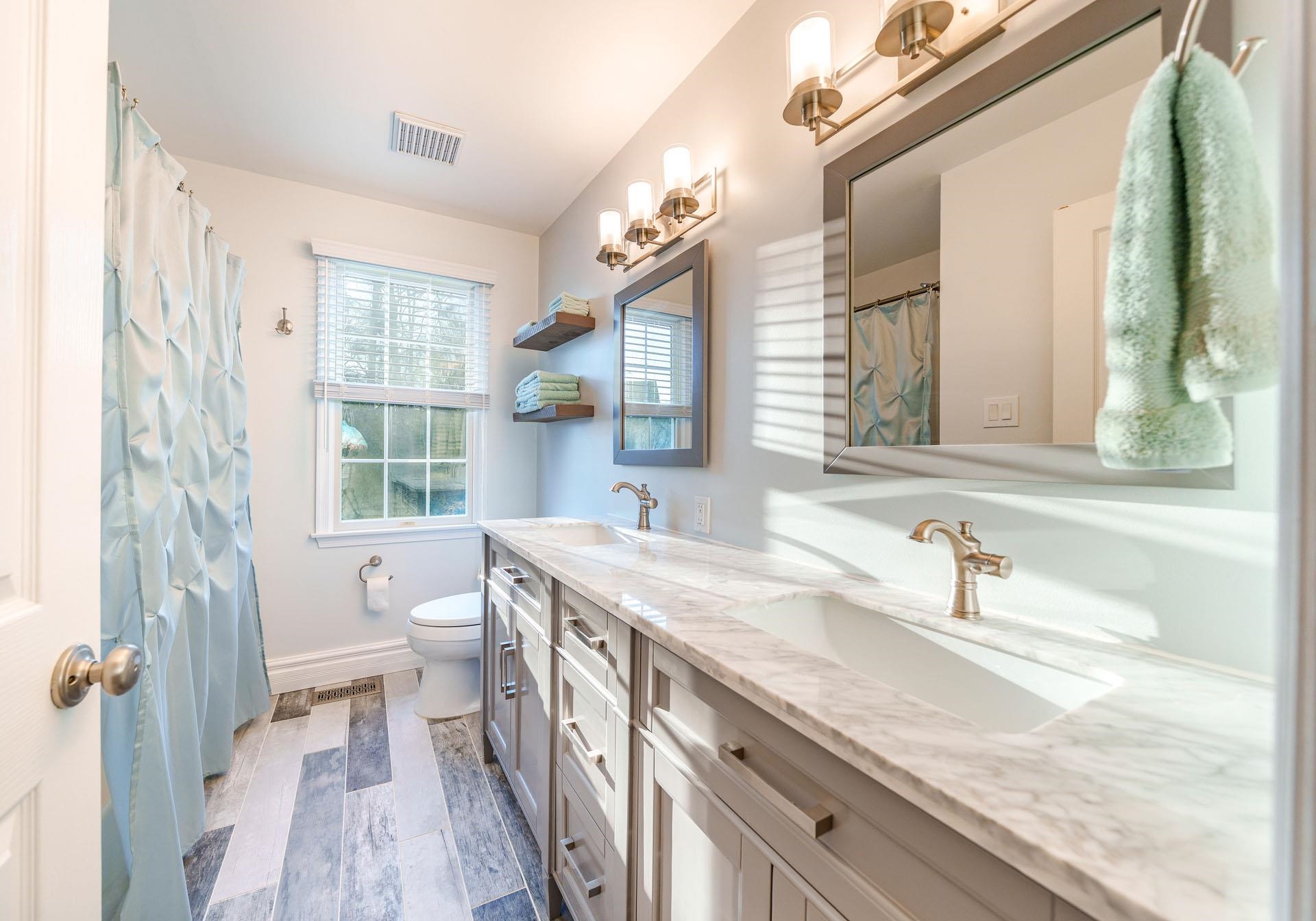 9 Deerfield Trail Woodbine, NJ 08270 - Photo 32 of 50 a bathroom with a sink a toilet a large mirror and shower
