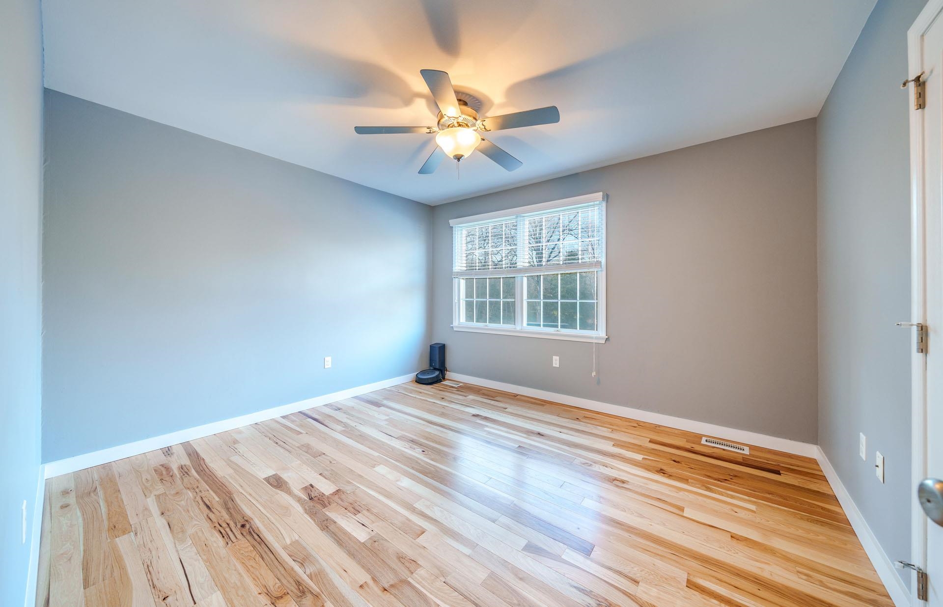 9 Deerfield Trail Woodbine, NJ 08270 - Photo 34 of 50 a view of an empty room with wooden floor and a window