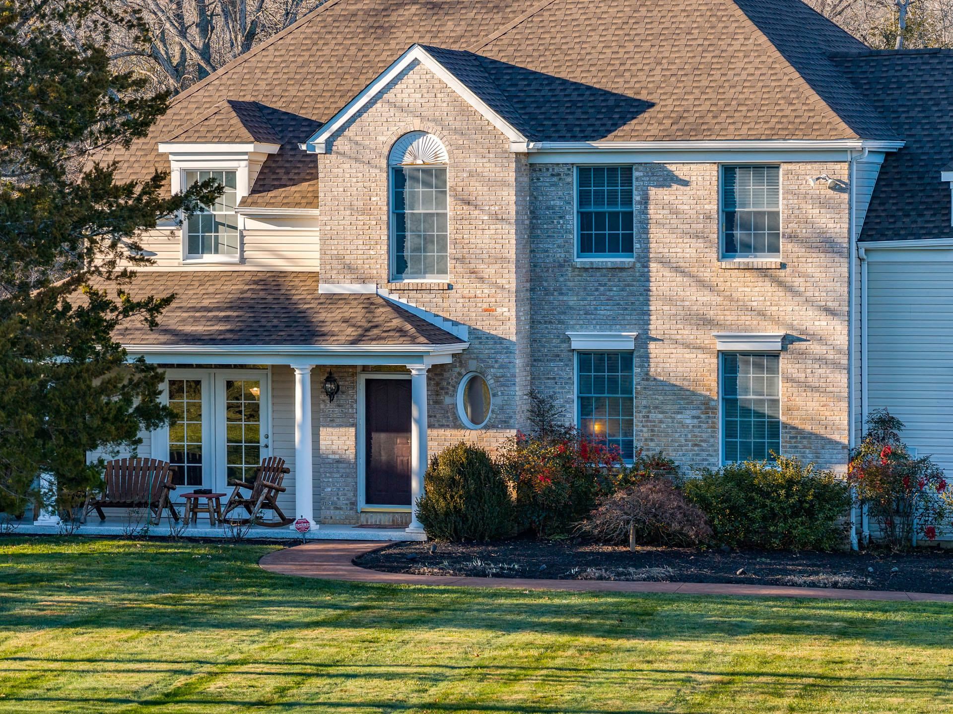 9 Deerfield Trail Woodbine, NJ 08270 - Photo 5 of 50 a front view of a house with a yard table and chairs