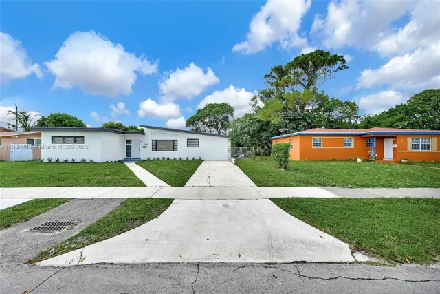 front view of house with a yard