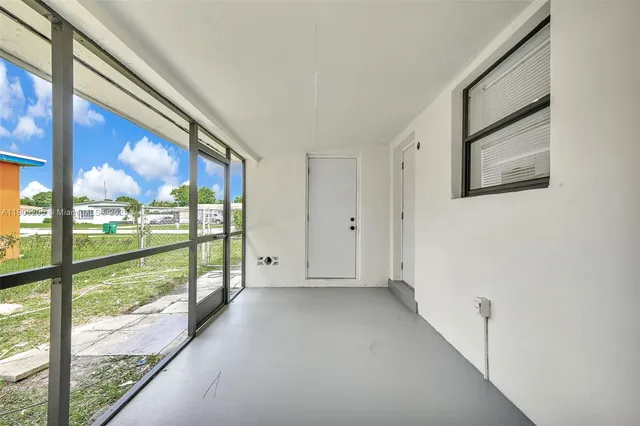 a view of a room with a large window