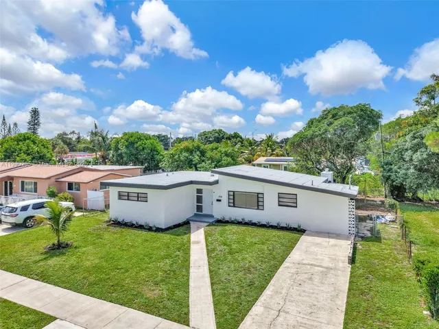 a view of house with outdoor space and yard