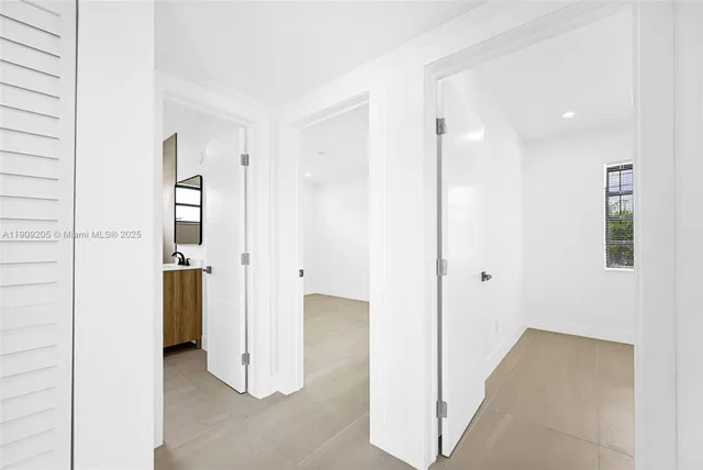 a view of a bathroom with a shower and a sink