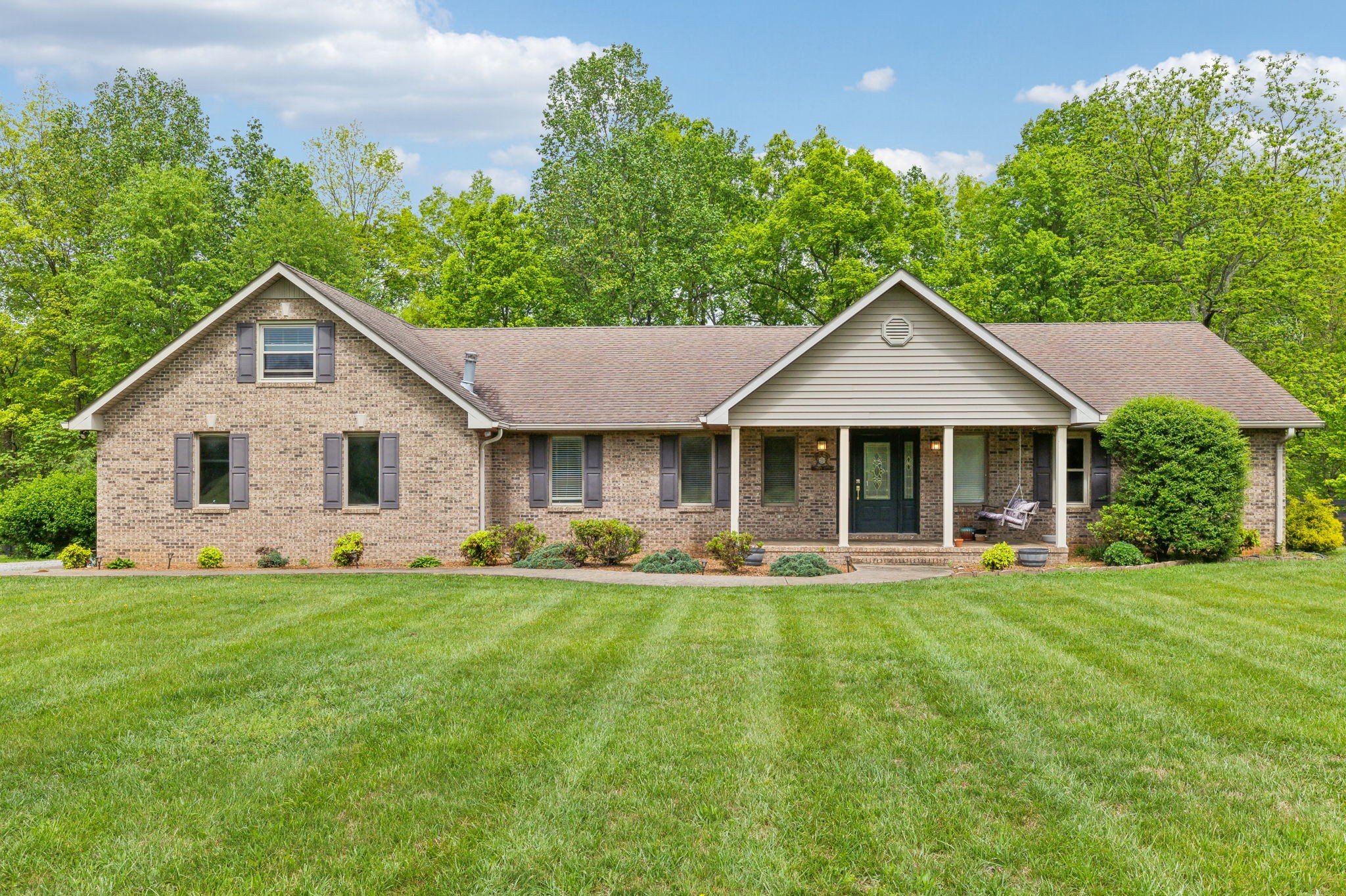 170 Cauble Ridge Lane Manchester, TN 37355 - Photo 1 of 71 a front view of a house with a garden and yard