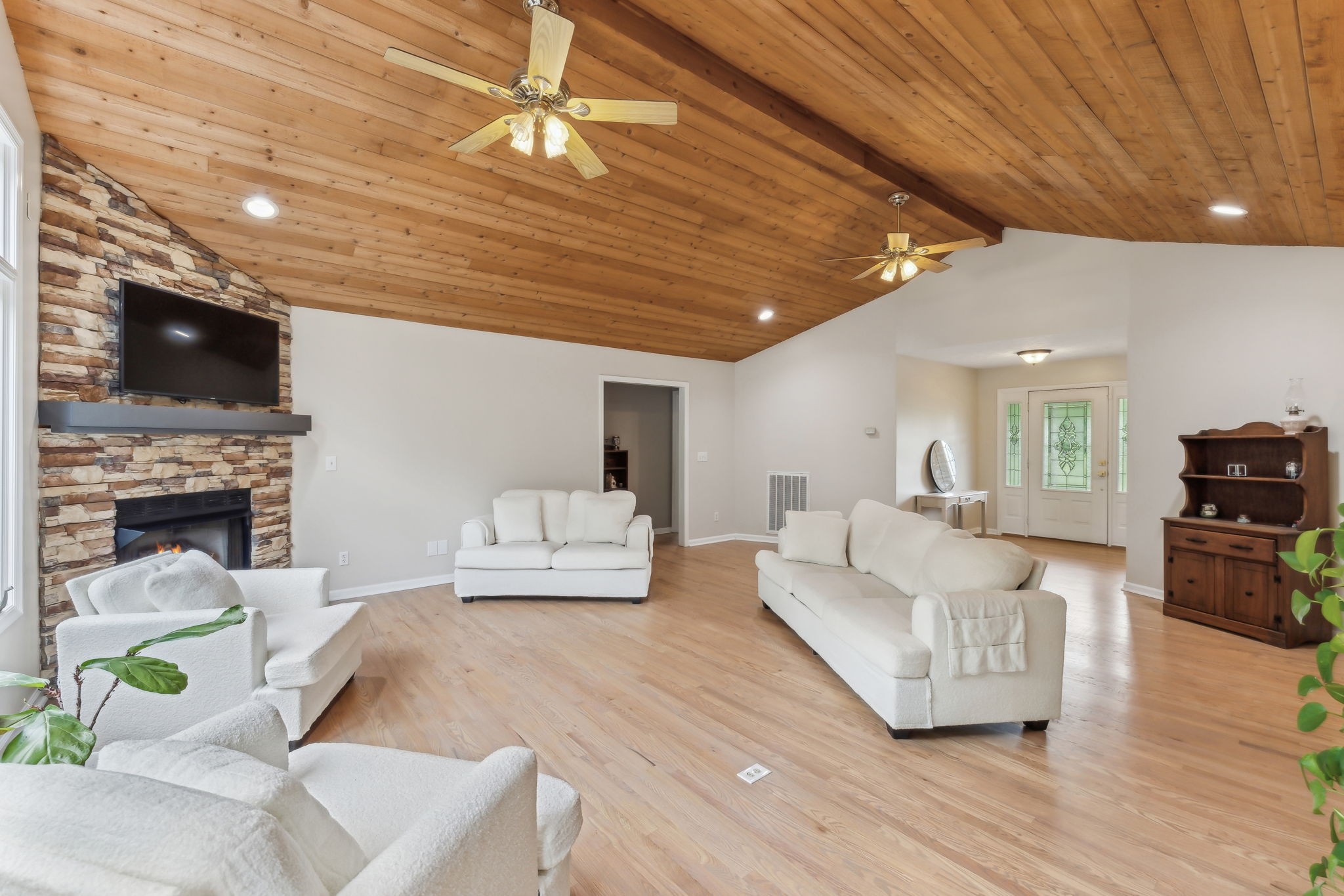 170 Cauble Ridge Lane Manchester, TN 37355 - Photo 16 of 71 a large living room with furniture a flat screen tv and a fireplace