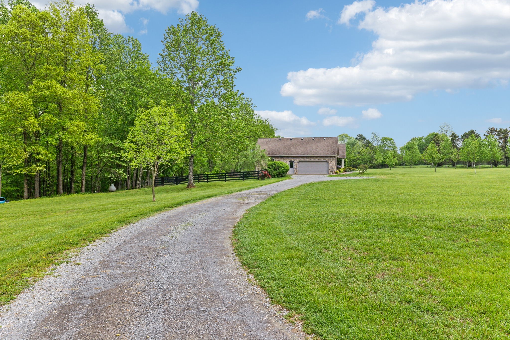 170 Cauble Ridge Lane Manchester, TN 37355 - Photo 3 of 71 a view of a garden with a building in the background
