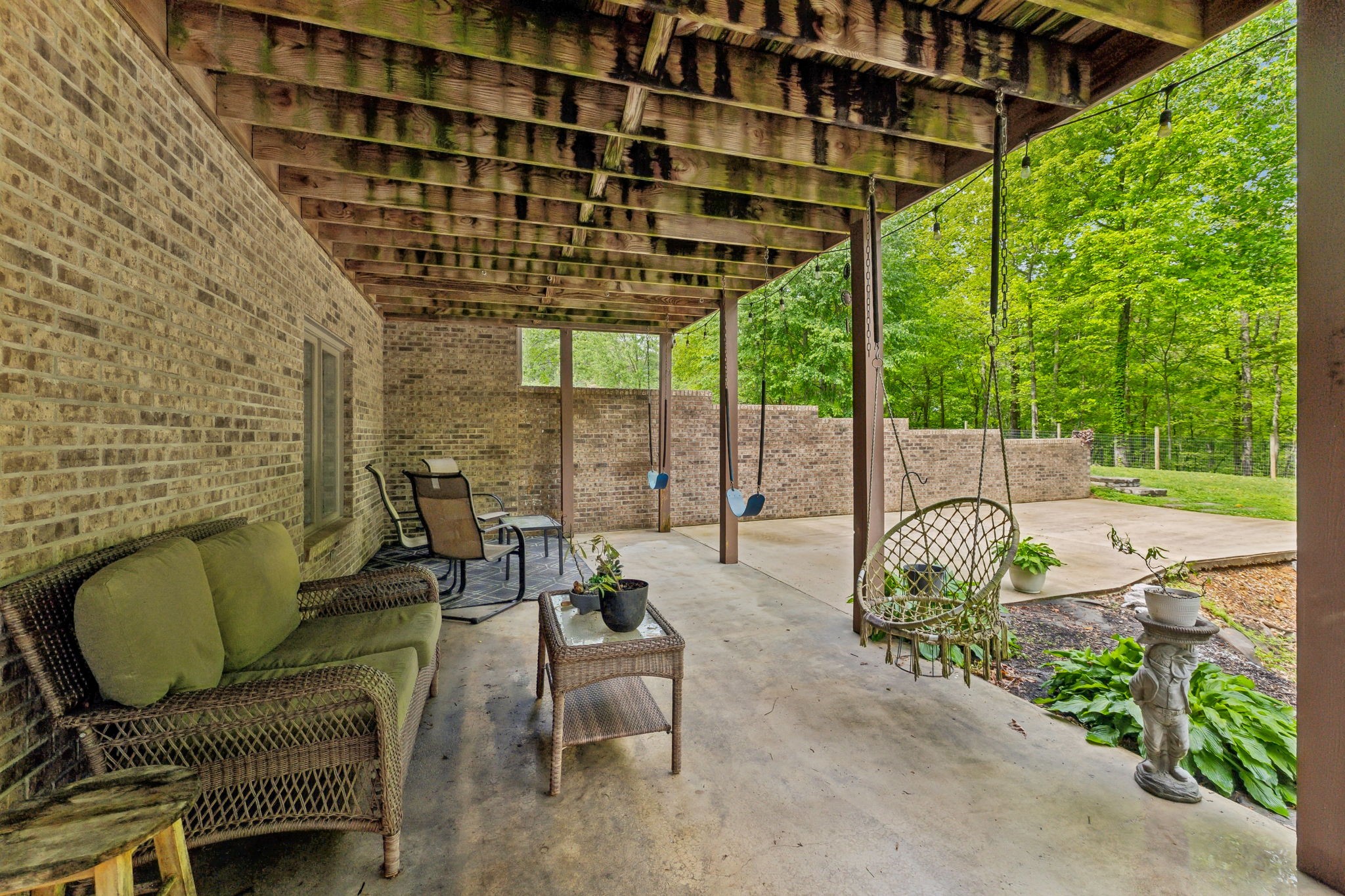 170 Cauble Ridge Lane Manchester, TN 37355 - Photo 50 of 71 a view of a patio with couches table and chairs and potted plants
