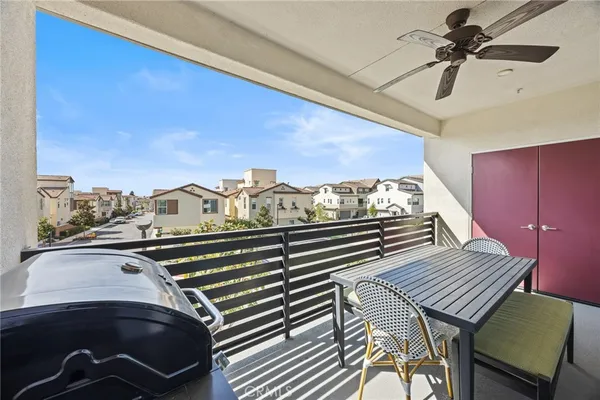 a view of a balcony with furniture