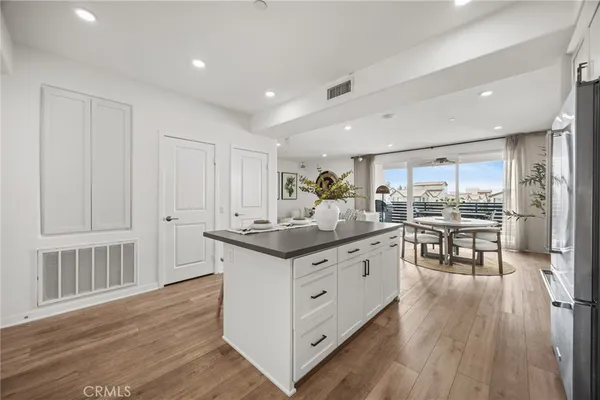 a kitchen with stainless steel appliances granite countertop a stove and cabinets