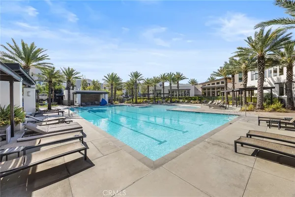 a view of swimming pool with chairs