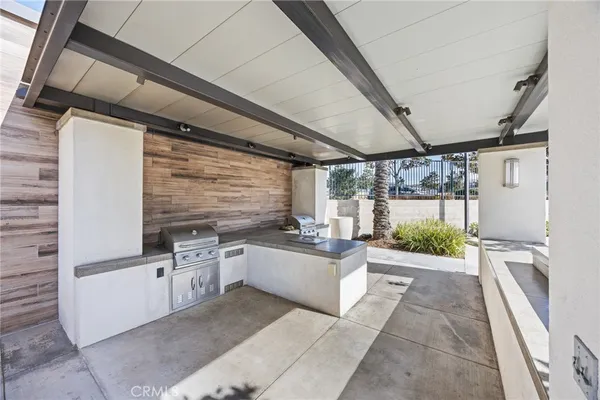 a kitchen with stainless steel appliances granite countertop a sink and cabinets