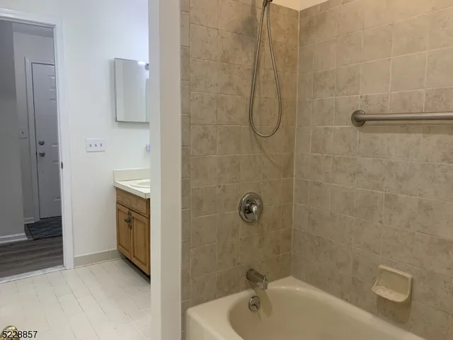 a white toilet sitting next to a bathroom sink