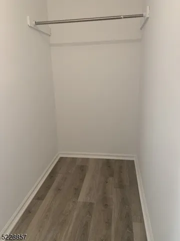 a view of a room with shelf on the wall