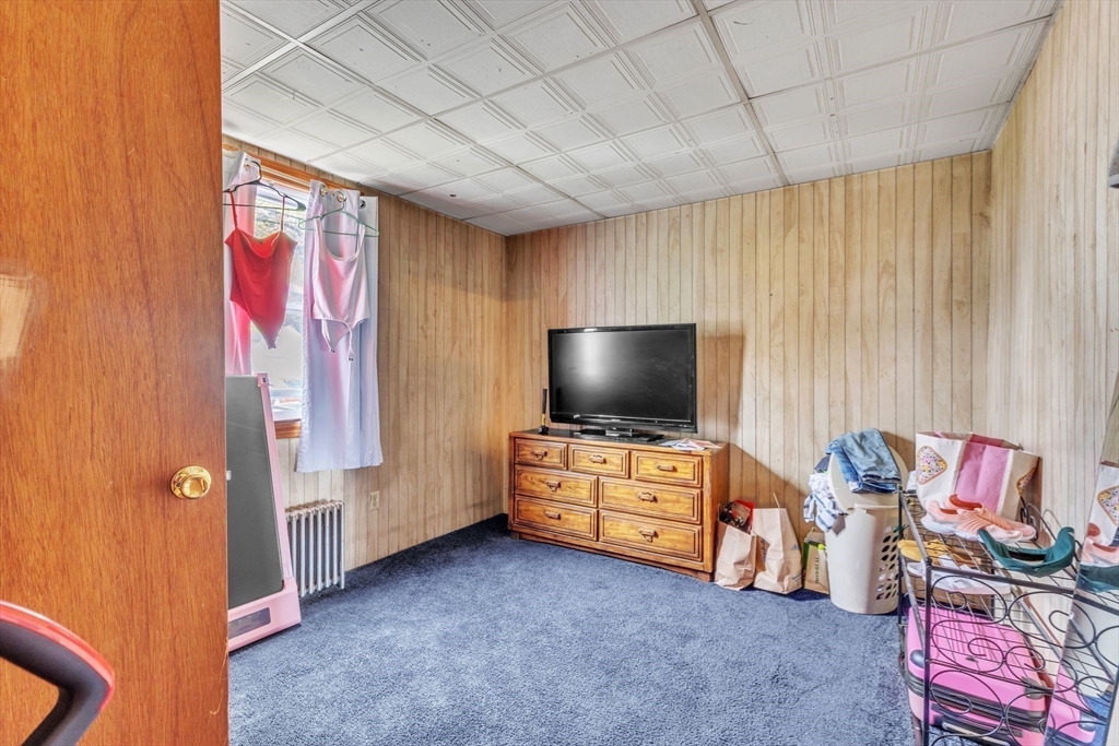 18 Goodwin Street Springfield, MA 01151 - Photo 15 of 31 a living room with furniture and a flat screen tv