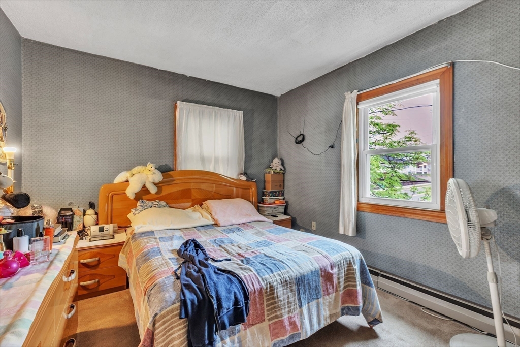 18 Goodwin Street Springfield, MA 01151 - Photo 22 of 31 a bedroom with a bed and a window