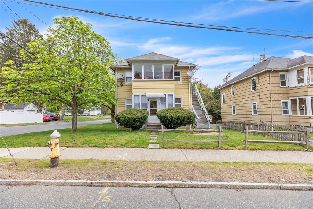 18 Goodwin Street Springfield, MA 01151 - Photo 3 of 31 a front view of a house with a yard and porch