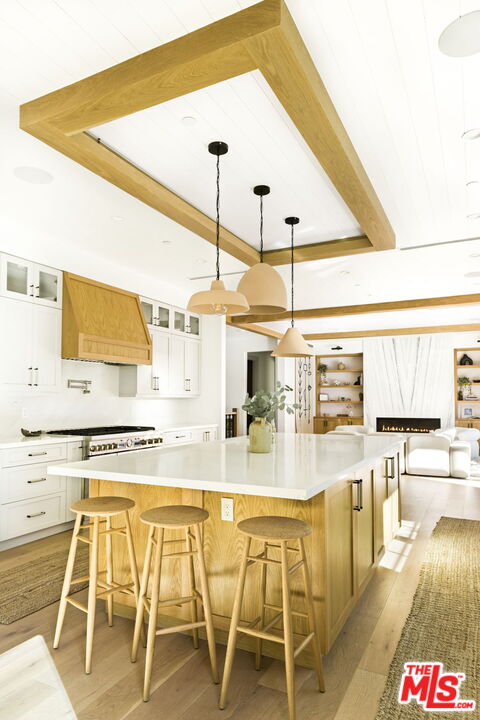 6310 Mirror Lake Drive Los Angeles, CA 90068 - Photo 11 of 34 a dining hall with stainless steel appliances kitchen island granite countertop a table and chairs with wooden floor